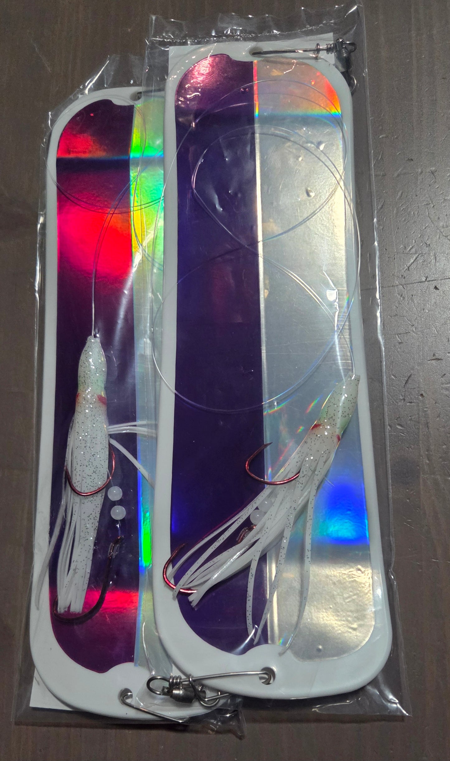 Fishing lure packaging with colorful design on a dark surface